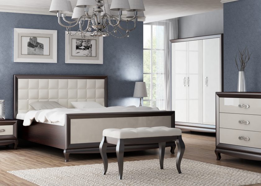 The visualisation shows a bedroom with furniture from the Sofia collection. A large bed with a quilted headrest, bedside tables, a chest of drawers and a bench. The drawers have decorative handles.
