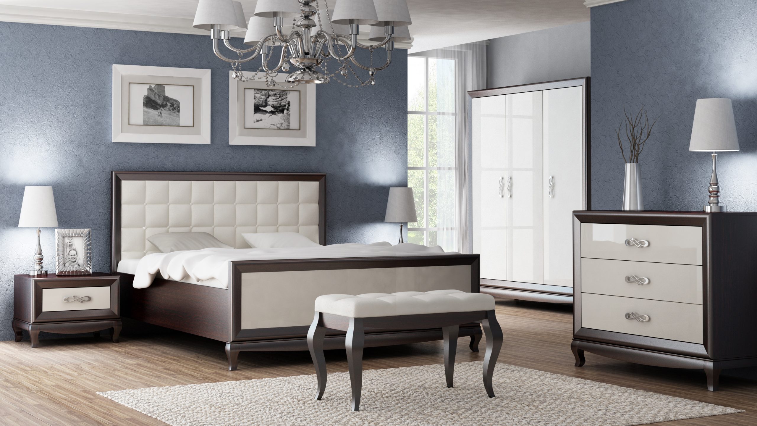 The visualisation shows a bedroom with furniture from the Sofia collection. A large bed with a quilted headrest, bedside tables, a chest of drawers and a bench. The drawers have decorative handles.