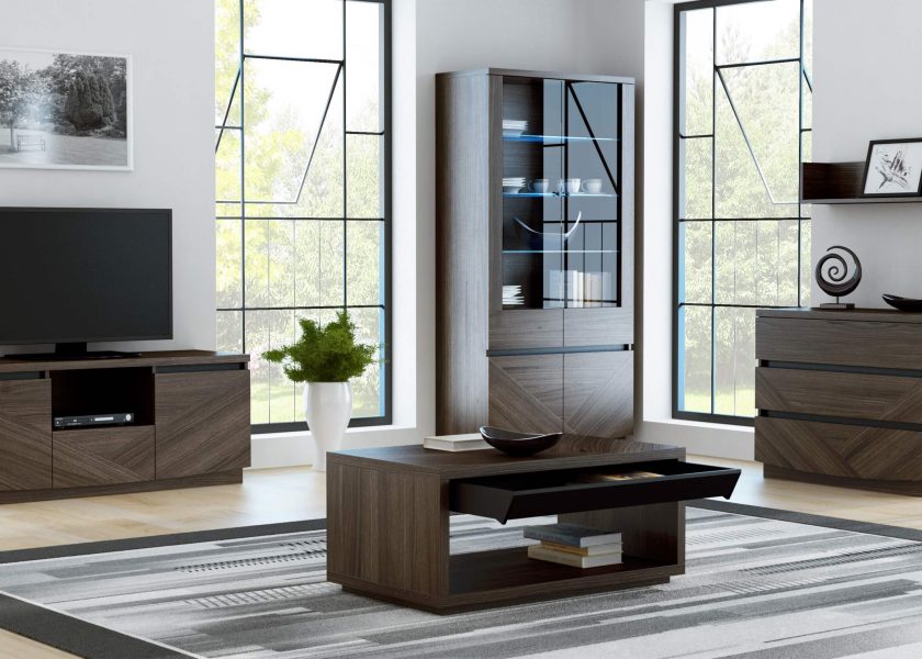 The visualisation presents a modern living room furnished with furniture from the Palermo collection, the collection includes a chest of drawers, a display cabinet, a rtv cabinet and a coffee table with a pull-out drawer. The beautiful colour of the natural oak veneer adds an elegant warmth to the collection. Interesting geometric arrangements of the wood grain on the fronts emphasize its modern character and black glass inserts give it lightness.
