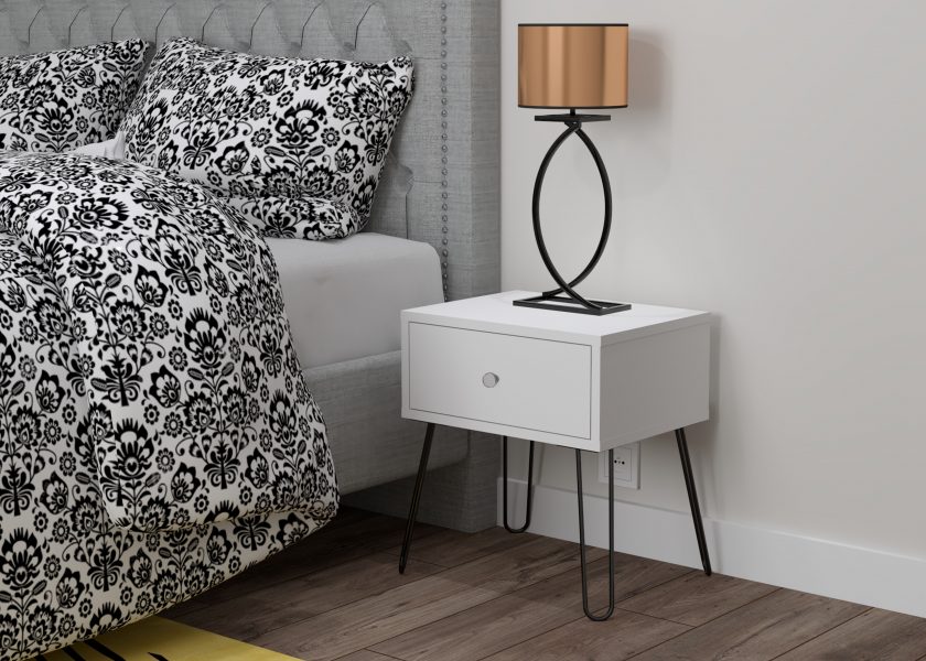 Visualisation of a bedside cabinet, the cabinet is made of white board with light fuse legs, a bedside lamp stands on the cabinet.