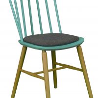 The photo shows a chair model EurosB from the Jura collection. The chair has wooden legs and an upholstered seat.
